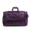 A purple Legacy brand duffel bag with multiple zippered pockets and top handles, shown on a white background with a Legacy logo at the top and an orange-red banner at the bottom containing the website.