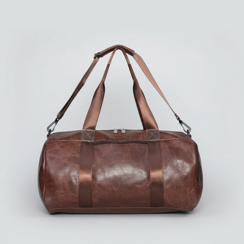 Brown leather duffel bag on a light gray background

Brown Duffle Bag, Leather Travel Bag, Men's Travel Bag, Brown Gym Bag, Duffle Bag for Men, Weekend Travel Bag, Shoulder Strap Bag, Premium Travel Bag, Overnight Bag, Stylish Duffle Bag, Carry Bag, Brown Leather-Look Bag

Shop a stylish brown leather-look duffle bag for men. Featuring a spacious design, durable handles, zipper closure, and an adjustable shoulder strap, it's ideal for gym sessions, weekend trips, and everyday travel.