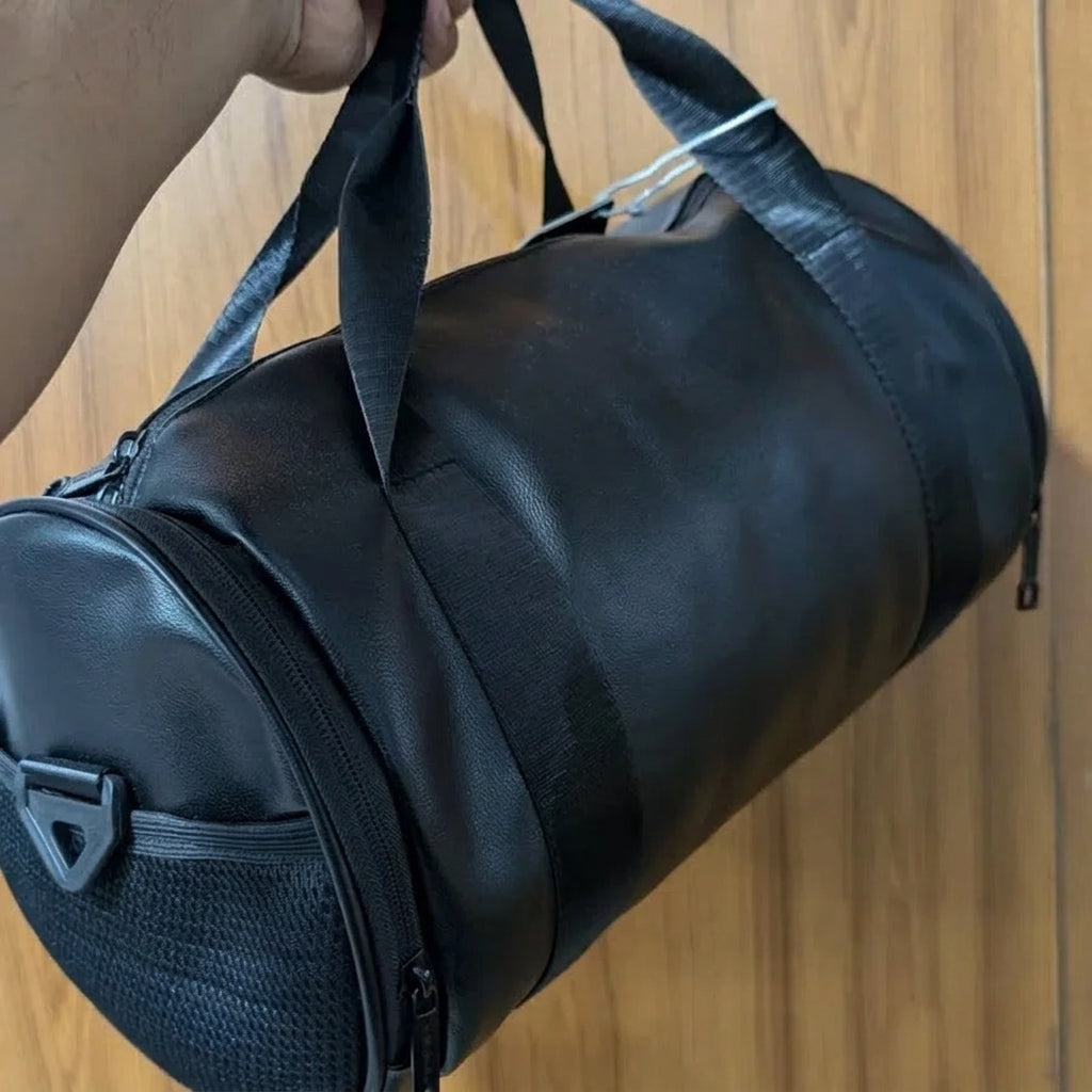 Black duffel bag with a brand logo held by a person on a wooden floor.

duffle bag, travel bag, gym bag, black bag, leather duffle bag, shoulder bag, mens bag, legacy, mens accessories

Upgrade your travel style with the Premium Black Duffle Bag by Legacy™. Durable, spacious, and perfect for gym, weekend trips, and travel. Shop now for the best price!
