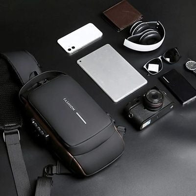 Black backpack with various items on a dark surface

Men's Anti-Theft Crossbody Sling Bag – Waterproof Chest Bag with USB Port