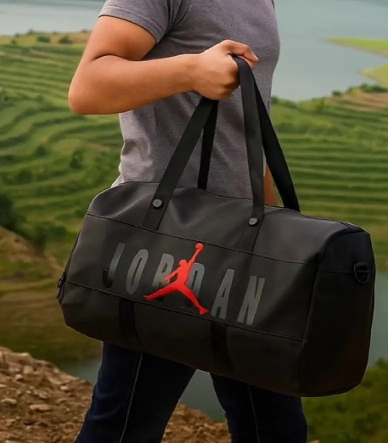 Person holding a black Jordan duffel bag with a scenic background

Lightweight, ergonomic, and business-friendly packs from brands like Arctic Hunter offer dedicated laptop and shoe compartments

durable duffle bags in Bangladesh at Patchee BD. Perfect for the gym, travel & weekend trips
