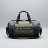 Two green duffel bags with black handles and 'arctic hunter' branding on a grassy background.