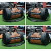 Brown duffel bag with black accents and 'arctic hunter' branding on a grassy background.