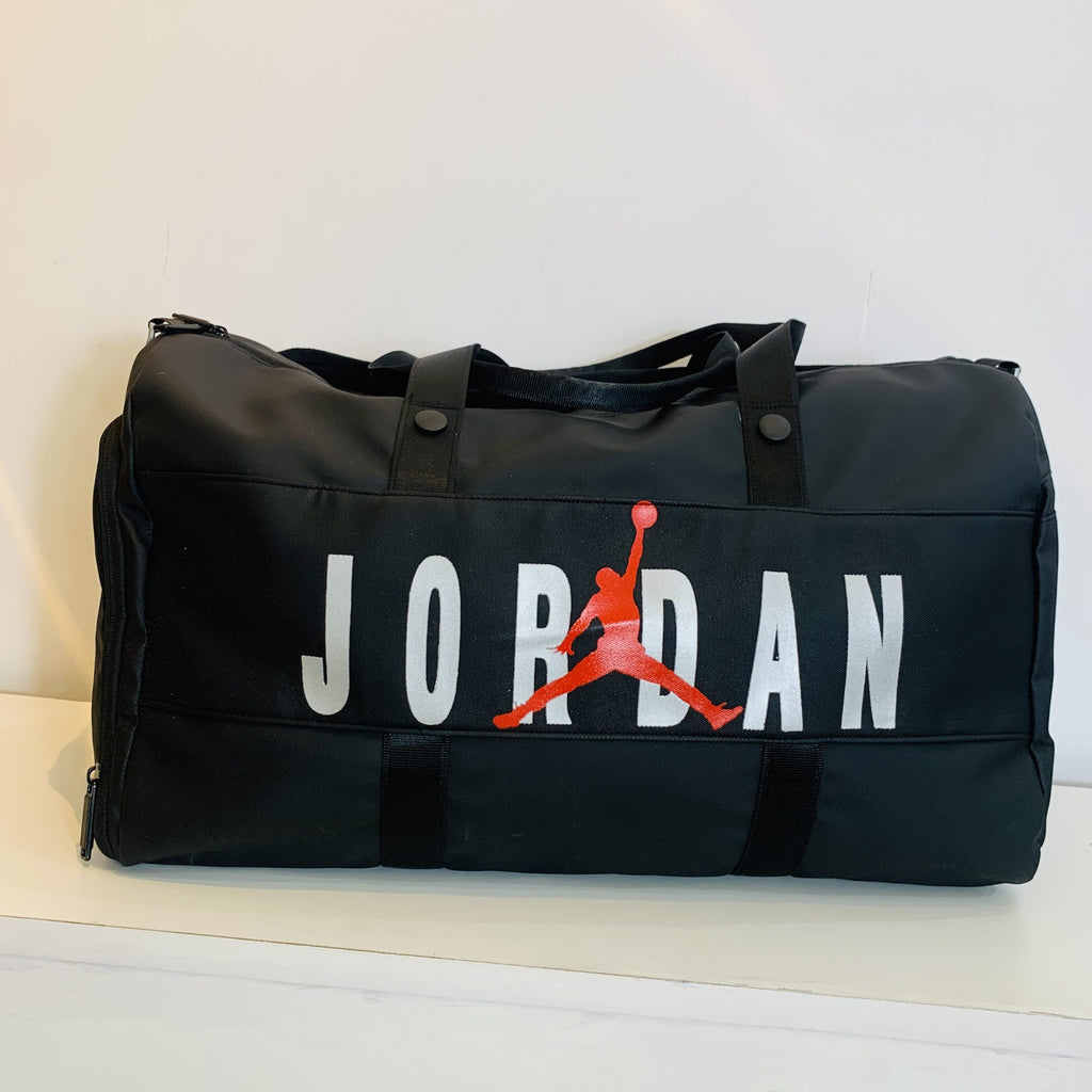 Black duffel bag with Jordan logo on a white background
