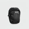 Person wearing a black tactical pouch on a white background